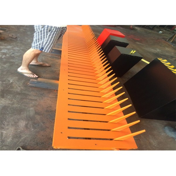 Industrial grade electromechanical tyre killer security barrier with black and yellow reflective stripes