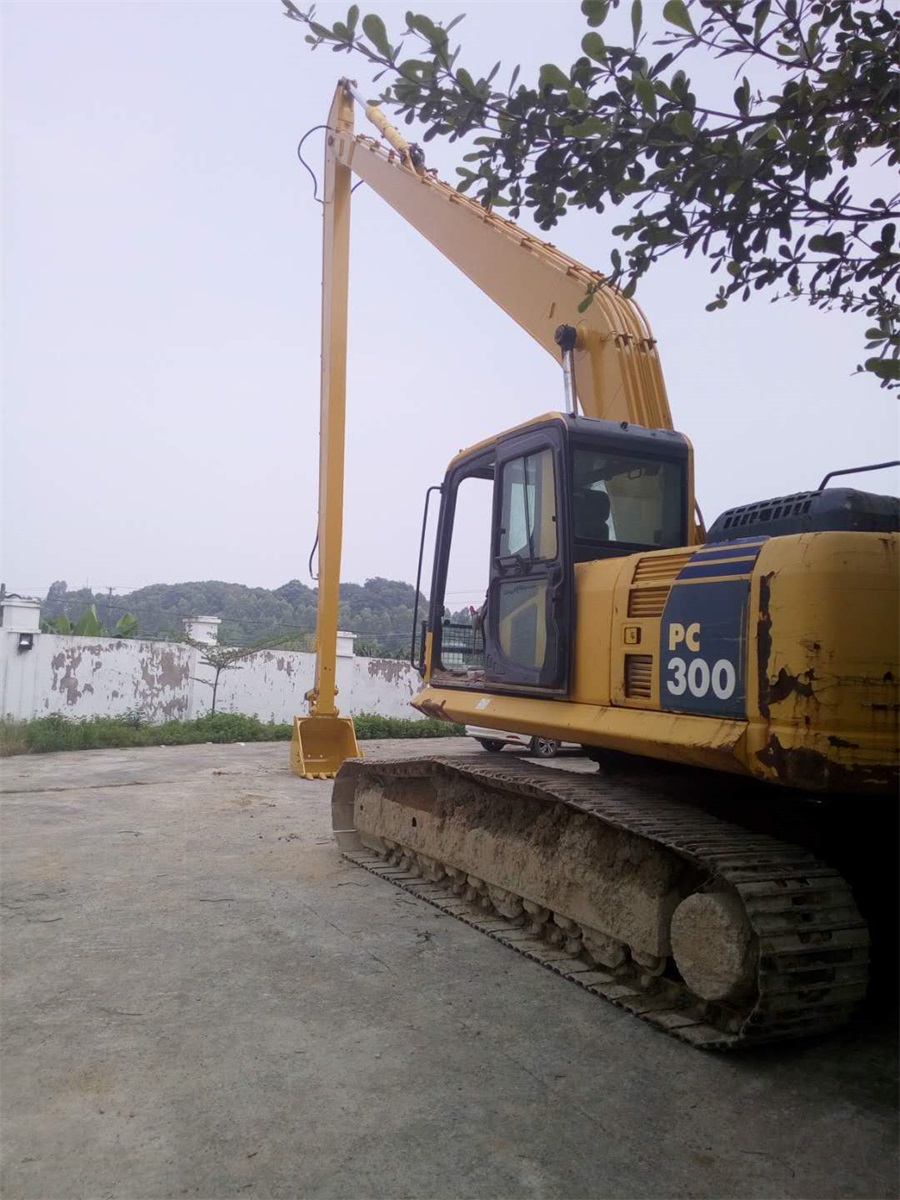 Excavator extension arm for foundation pit, caisson, basement excavation