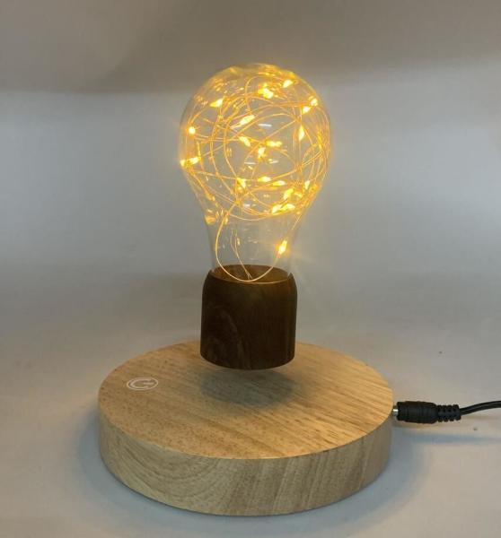 Quality round base wireless magnetic levitation desk lamp light night bulb for sale