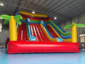 China New Design Tarpaulin Fireproof Commercial Inflatable High Slide Palm Theme Giant Inflatable Slide Castle For Kids And Ad on sale