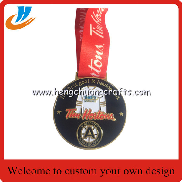 Polished gold Olympic games medals with ribbon, Olympics trophy and award medals