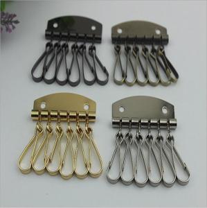 China Fashion Style Leather Key Chain Zipper Card Wallet Unisex Iron gold Keychain Holder with 6 Hooks Snap Closure on sale