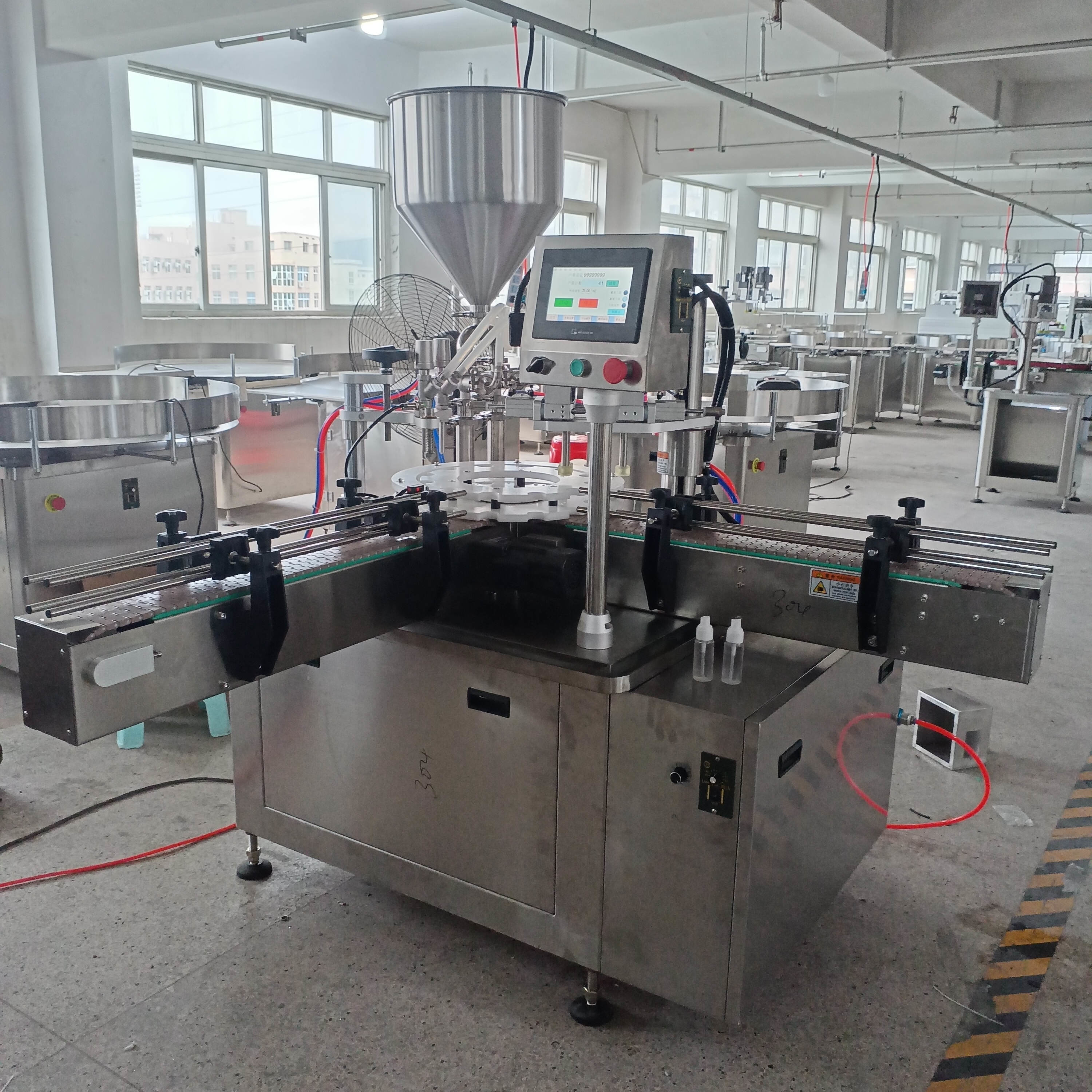High Efficiency Filling And Precise Capping Automatic Duck Bill Cap Filling And Spinning Machine