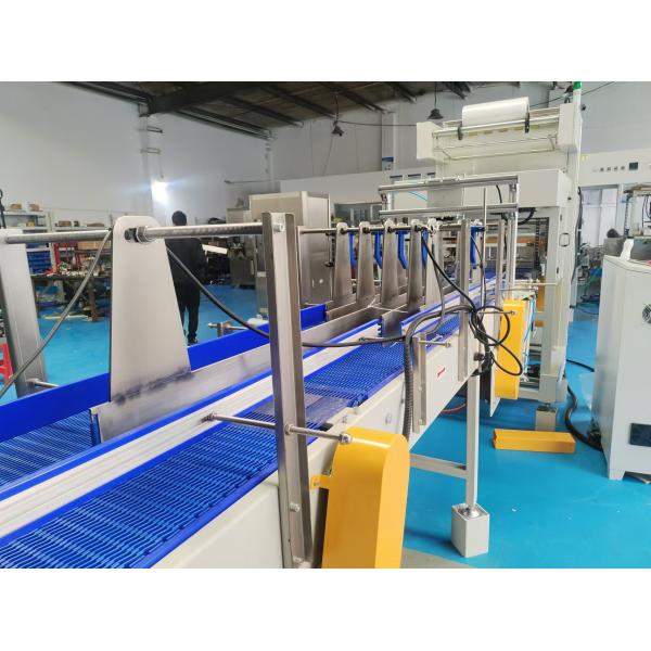 Straight-line heat-shrink packaging machine