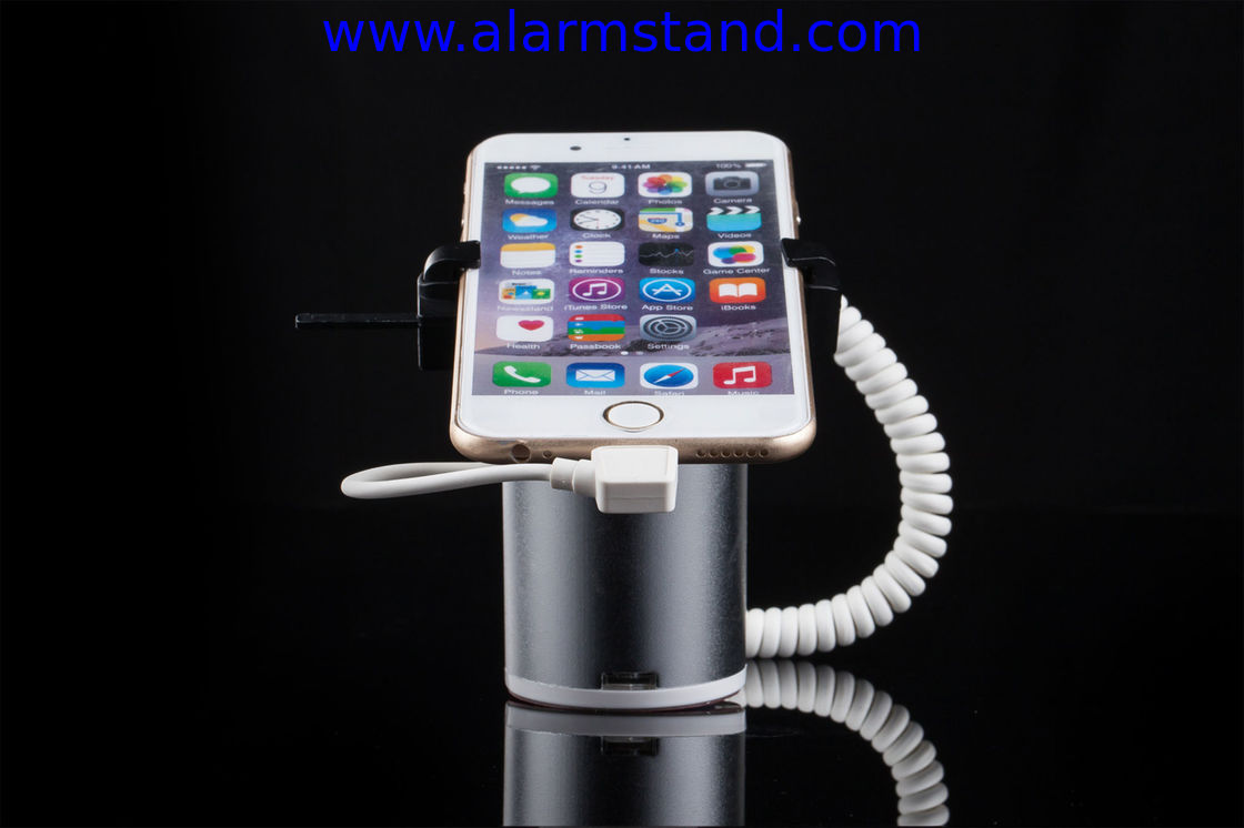 COMER High quality Rotating display stand for phone with charging cable and alarm sensor