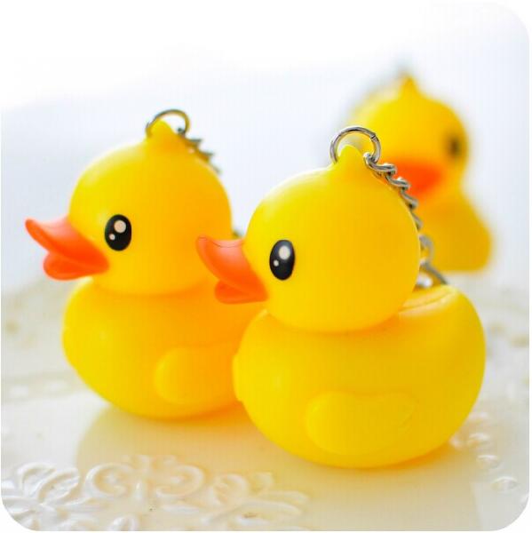 Quality Key chain plastic rubber material yellow duck keychain sound & flash light keychain for sale