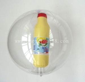 Inflatable beach ball with bottle inside