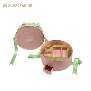 Buy cheap Custom Luxury Boxes WholesalRound Cosmetic Paper Box With Unique Design Mini Drawer Box Green Ribbon Handle And Gold Tray For Beauty Essentials product