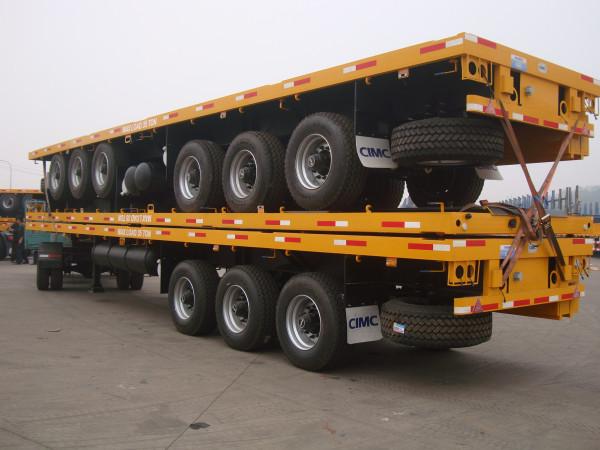 Quality low price 3 axles 40ft container flatbed semi trailer with container locks for sale