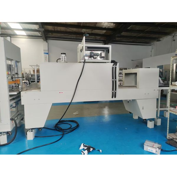 Straight-line heat-shrink packaging machine